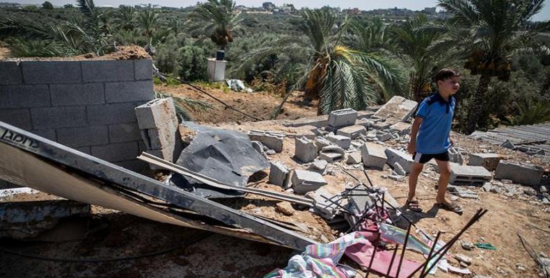 Damage to family home following Israeli airstrikes in Buriej refugee camp, central Gaza Strip, on Saturday.  (Photo: Khalil Hamra/AP Photo)