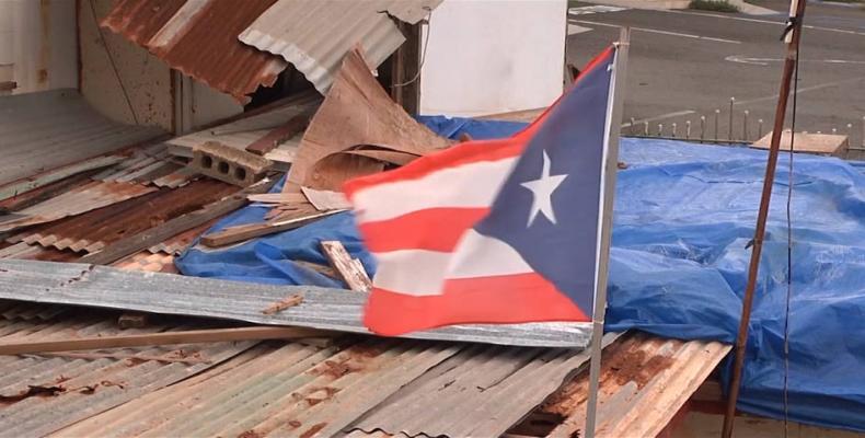 Puerto Rico marks anniversary of Hurricane Maria as Donald Trump denies death count.  Photo: AP