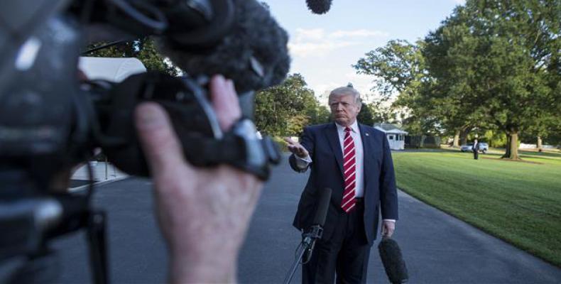 US President Donald Trump speaks with reporters outside the White House prior to his departure aboard Marine One on October 7, 2017 (Photo: AFP)