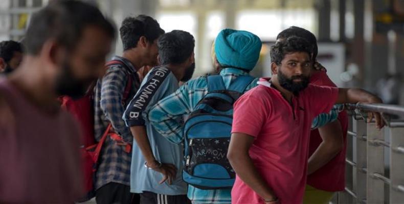 Indian nationals arrive at Indira Gandhi International airport in New Delhi after being deported from Mexico.  (Photo: AFP)