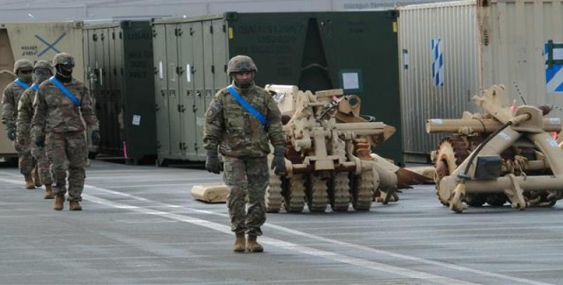 Military personnel take part in the unloading operation of U.S. military equipment in Germany, February 2020.  (Photo by AFP)