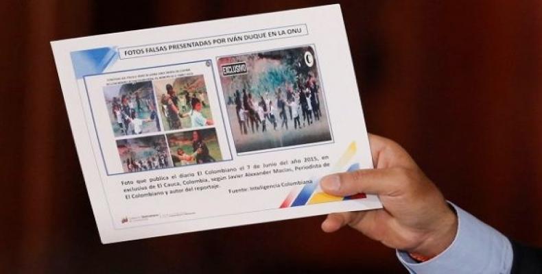 Venezuelan President Nicolas Maduro holding a picture to show Colombia used fake pictures.  (Photo: Reuters)