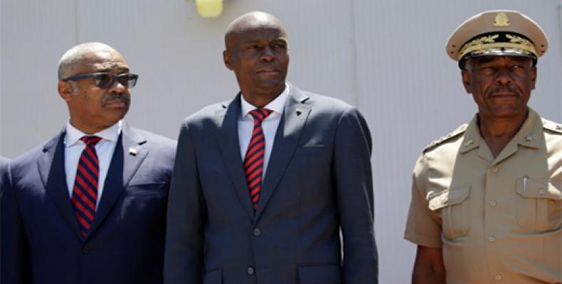 Haitian President Jovenel Moise (C), Prime Minister Jack Guy Lafontant and Chief of the army's high command Jodel Lessage